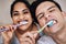 Couple who brush together, stay together. a young couple brushing their teeth together.