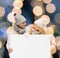 Couple in winter clothes with blank white board