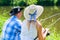 Couple, woman and man, with fishing rods sport angling