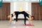 Couple womans in gym do yoga stretching exercises. Fit and wellness lifestyle