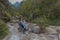 Couple of women making a selfie in a mountain stream.