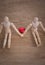 A couple of wooden doll man on valentine days showing love to each other