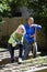 Couple working on vegetable garden in backyard