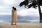 Couple Wrapped In Blanket Looking At Infinity Pool