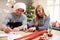 Couple Wrapping Christmas Gifts At Home