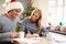 Couple Writing Christmas Cards Together