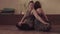 Couple Yoga. Two women sitting back to back and doing twist