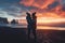 A couple of young hikers with heavy backpacks admiring scenic view of spectacular Icelandic nature. Breathtaking landscape of