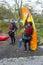 A couple of young men clearing their boating equipment after an afternoon of kayak training on the lake in Castlewellan Forest Par