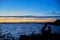 Couple of young people contemplate the Sunset in the Albufera of Valencia