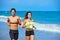 Couple young running in the beach in summer