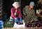 Couple of young smallholder farmers sorting freshly picked eggplants