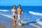 Couple young walking on the beach shore