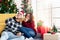 Couples celebrating Christmas decorating in home