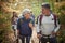 Couples hiking through the woods