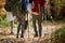 Couples hiking through the woods