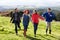 Couples holding hands on country walk