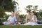 Couples Holding Wine Glasses On Picnic