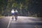 Couples of man riding touring bicycle on mountain road