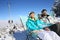 Couples of skiers sunbathing on the slopes