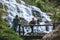 Couples travel relax to photograph the waterfalls beautiful. In the winter. at the waterfall mae ya chiangmai in thailand. travel