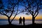 Couples under the tree at sunset