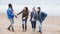 Couples Walk Along Winter Beach