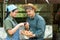 Couples are working at the chicken egg farm. And are choosing fresh eggs Both look happy and healthy