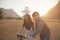 couples of younger asian man and woman practice to riding bicycle in natural field relaxing emotion