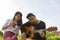 Couples of younger asian man and woman relaxing playing guitar in park