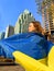 courage fearless confident look teenager girl looks to side Ukrainian flag skyscrapers Ukraine during war Canada