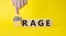 Courage and rage symbol. Businessman hand points at wooden cubes with words Rage and Courage. Beautiful yellow background.