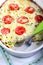 Courgette, peas, cheese and tomato frittata