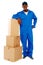 Courier boy standing beside boxes
