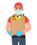 Courier or deliveryman in mask and gloves holding grocery pack. Person carrying vegetable paper bag. Man giving shopping products
