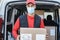 Courier driver man delivering package while wearing safety mask - Focus on face