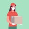 Courier girl in a protective mask and gloves, who brought a box. Delivery woman, safe delivery..Vector in flat style