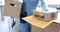 Courier hands over box with parcel closeup