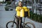 Courier portrait with bicycle and bag outdoors