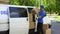 Courier taking out boxes from van, moving company service, relocation firm