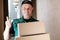 Courier, uniform mail worker brought a parcel to the address and gives it to customers, delivery of ordered goods, online shopping