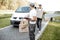 Couriers delivering parcels by car