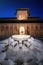 Court of the Lions with fountain at Nasrid Palaces of Alhambra at night - Granada, Spain