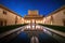 Court of the Myrtles in Comares Palace at Nasrid Palaces of Alhambra at night - Granada, Andalusia, Spain