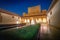 Court of the Myrtles in Comares Palace at Nasrid Palaces of Alhambra at night - Granada, Andalusia, Spain