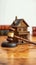 Courthouse symbolism Toy house and gavel signify legal concepts
