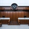 A courtroom with wooden benches and a vintage clock on the wall Ai Generated