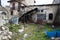 Courtyard of an abandoned stone traditional house. Deserted village places.