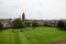 Courtyard of the Arbroath Abbey in Scotland with cityscape of the town