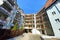 Courtyard with balconies in a multi-storey residential building, bike storage on the balcony